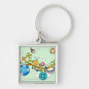 Side view of children playing on tree branch key ring