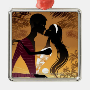 Side view of young couple standing in beach metal tree decoration