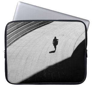 SILHOUETTE OF A PERSON WALKING ON GRAY CONCRETE FL LAPTOP SLEEVE