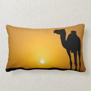 Silhouette of a wild camel at sunset lumbar cushion