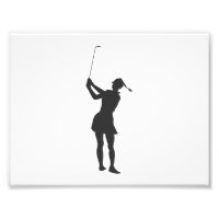 Silhouette of a woman playing golf