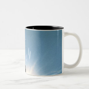 Silhouette of bald eagle flying in sky Two-Tone coffee mug