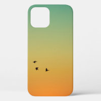 SILHOUETTE OF BIRDS FLYING DURING SUNSET