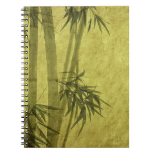 Silhouette of branches of a bamboo on paper notebook