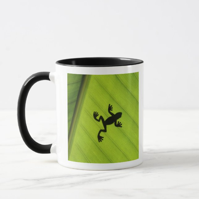 Silhouette of frog through banana leaf mug (Left)