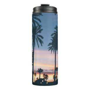 Silhouette of houses beside palm trees and pathway thermal tumbler