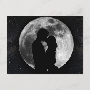 Silhouette of lovers in a full moon at night postcard