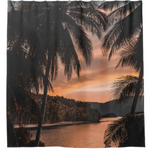 Silhouette of palm tree during golden hour shower curtain
