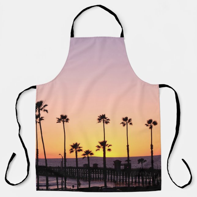 Silhouette of palm trees and dock during sunset apron (Front)