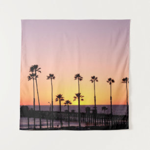 Silhouette of palm trees and dock during sunset tapestry