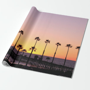 Silhouette of palm trees and dock during sunset wrapping paper