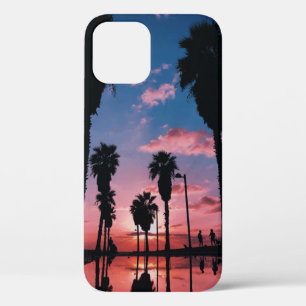 Silhouette of tree under cloudy sky iPhone 12 case