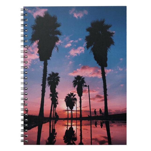 Silhouette of tree under cloudy sky notebook (Front)