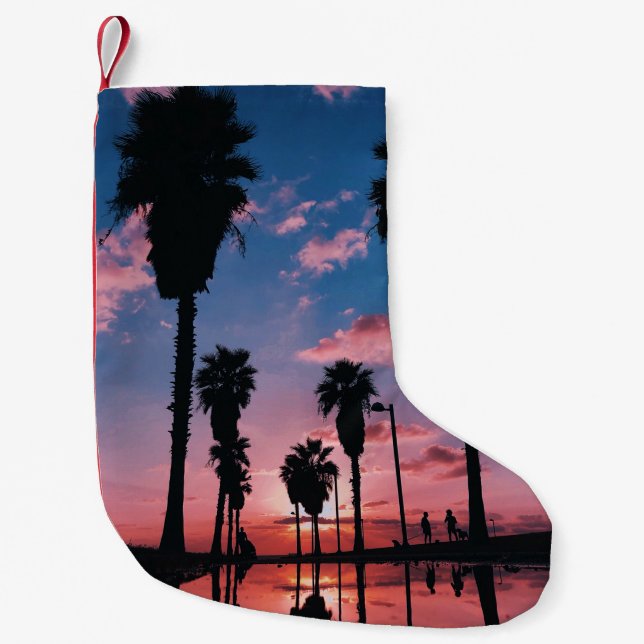 Silhouette of tree under cloudy sky small christmas stocking (Front)
