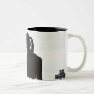 Silhouette of woman lifting weights at gym Two-Tone coffee mug