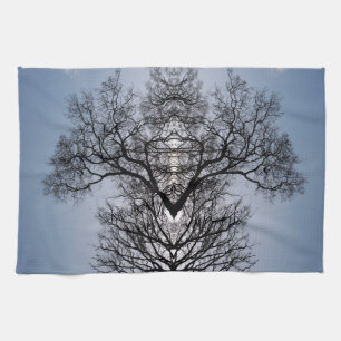 Silhouetted tree pattern and blue sky tea towel