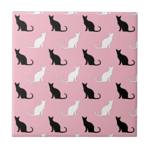 Silhouettes Of Black and White Cats On Pink Ceramic Tile