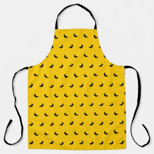 Silhouettes of Small Black Bananas on Yellow Apron