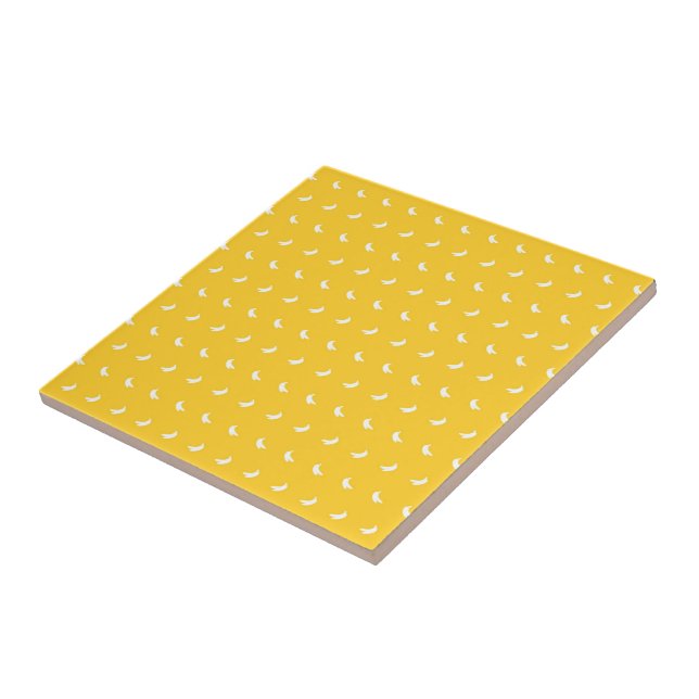Silhouettes of Small White Bananas on Yellow Ceramic Tile (Side)
