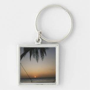 Silhuetted empty hammock at sunset key ring