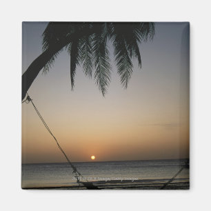 Silhuetted empty hammock at sunset magnet
