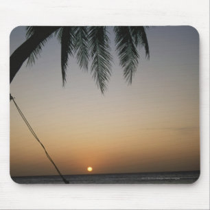 Silhuetted empty hammock at sunset mouse pad