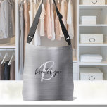 Silver Brushed Metal Black White Script Monogram  Crossbody Bag<br><div class="desc">This elegant personalised crossbody bag features a monogram and first name in modern black and white script on a silver faux brushed metal background.</div>