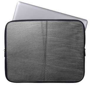 Silver chain link on grey textile laptop sleeve