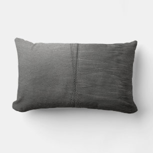 Silver chain link on grey textile lumbar cushion