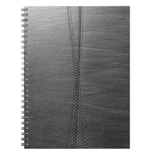 Silver chain link on grey textile notebook