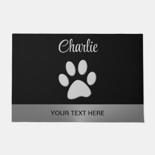 Silver Dog Paw on black background Doormat