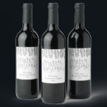 Silver Foil Effect Typography Merry Christmas Wine Label<br><div class="desc">Decorate your Christmas party this holiday season with these unique and modern Christmas bottle labels. The design features a festive silver foil effect typography script "Merry Christmas" with matching hanging foliage on a clean white background. Easily add your custom wording to these holiday labels by using the "Edit this design...</div>