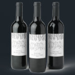 Silver Foil Effect Typography Merry Christmas Wine Label<br><div class="desc">Decorate your Christmas party this holiday season with these unique and modern Christmas bottle labels. The design features a festive silver foil effect typography script "Merry Christmas" with matching hanging foliage on a clean white background. Easily add your custom wording to these holiday labels by using the "Edit this design...</div>
