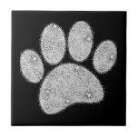 Silver Glitter Dog Pawprint Ceramic Tile<br><div class="desc">Cartoon dog pawprint with silver glitter effect. All that's seen is printed,  no actual glitter will be used in the making.
Decorative square ceramic tiles for homes and businesses like pet shops.
Gift idea for dog lovers.</div>
