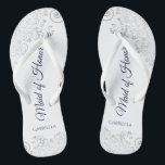 Silver Lace Navy on White Maid of Honour Wedding Thongs<br><div class="desc">These beautiful wedding flip flops are a great way to thank and recognise your Maid of Honour while saving her feet at the same time. Features an elegant design with silver grey lace on a white background and fancy navy blue coloured script lettering. The test reads Maid of Honour with...</div>