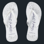 Silver Lace Navy on White Maid of Honour Wedding Thongs<br><div class="desc">These beautiful wedding flip flops are a great way to thank and recognise your Maid of Honour while saving her feet at the same time. Features an elegant design with silver grey lace on a white background and fancy navy blue coloured script lettering. The test reads Maid of Honour with...</div>