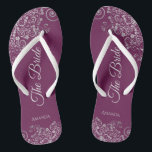 Silver Lace on Cassis Purple The Bride Wedding Thongs<br><div class="desc">Dance the night away with these beautiful wedding flip flops. Designed for the bride, they feature a simple yet elegant design with pale gray script lettering on a cassis purple, magenta, or berry colored background and fancy silver gray lace curls and swirls. Beautiful way to stay fancy and appropriate while...</div>