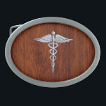 Silver Like Caduceus Medical Symbol Mahogany Print Belt Buckle<br><div class="desc">The Symbolic Silver Like Caduceus Medical Symbol design presented here on a mahogany wood grain printed background. The caduceus snakes is designed to look like it is made of chrome. Good for a graduation occasion, a statement for your profession, or for a gift with that medical look your are looking...</div>