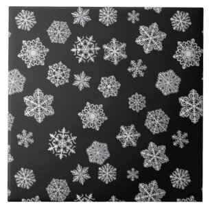 Silver snowflakes on a black background tile