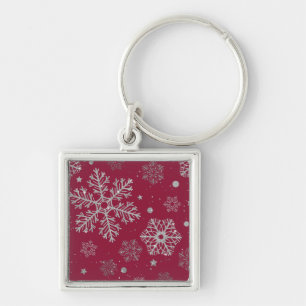 Silver snowflakes on dark red key ring