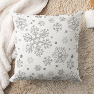 Silver snowflakes on white cushion