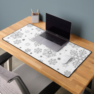 Silver snowflakes on white desk mat
