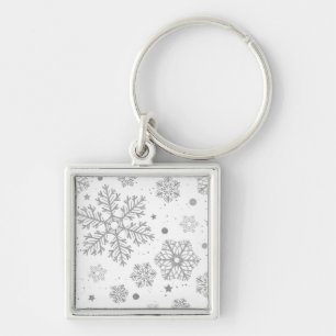 Silver snowflakes on white key ring