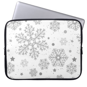Silver snowflakes on white laptop sleeve
