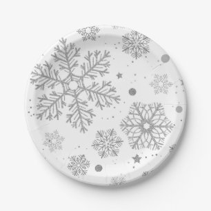 Silver snowflakes on white paper plate