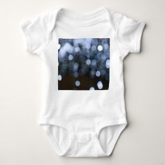 Silver, white bokeh night background. baby bodysuit
