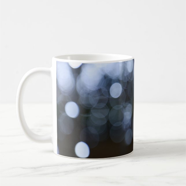 Silver, white bokeh night background. coffee mug (Left)