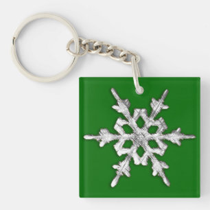 Silver & white snowflake on pine green key ring