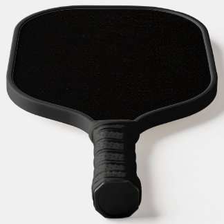 Simple black background with a slight pattern pickleball paddle