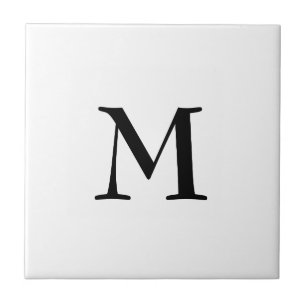 Simple black monogram on white ceramic tile